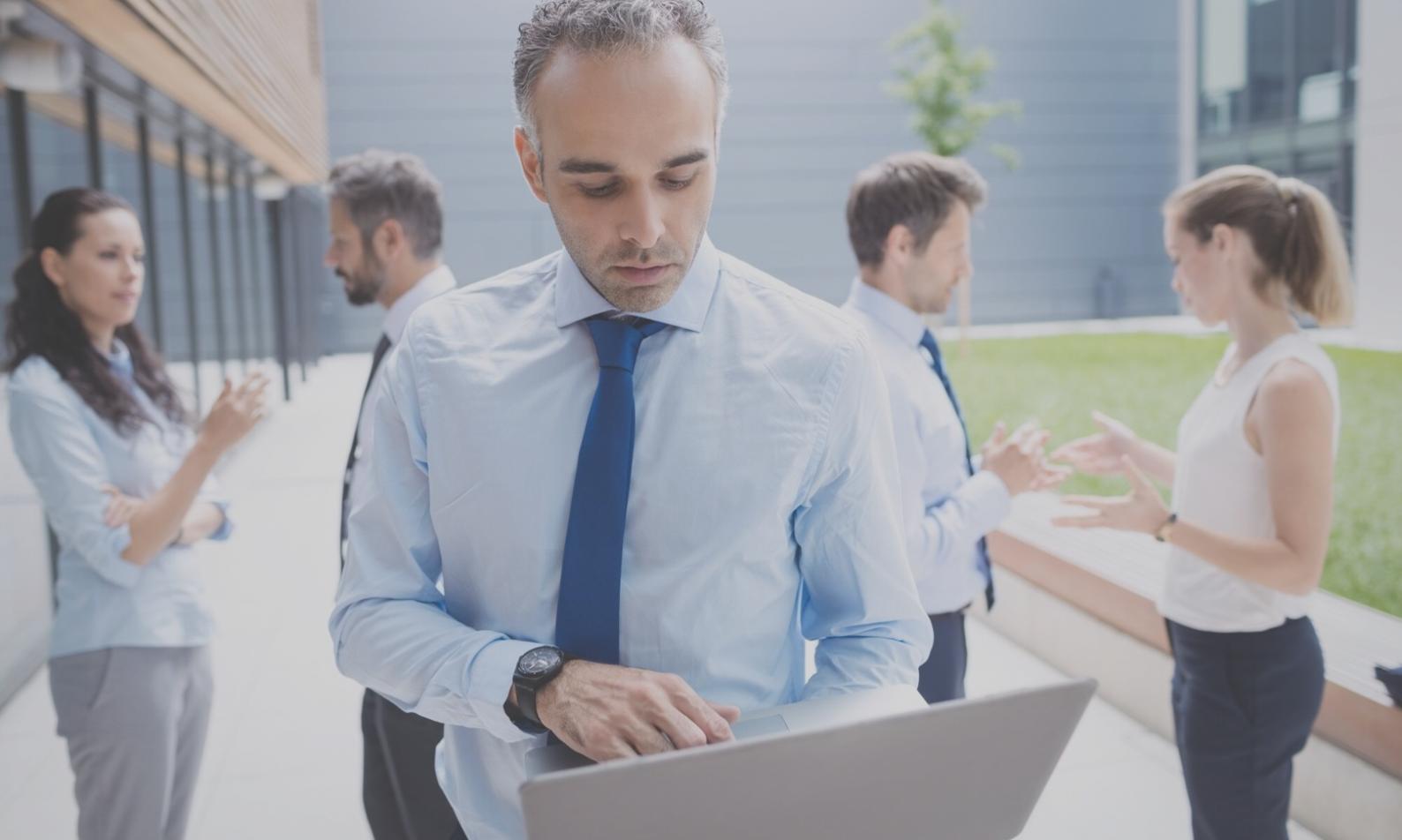 Financial consultant reviewing budget documents with client during consultation meeting