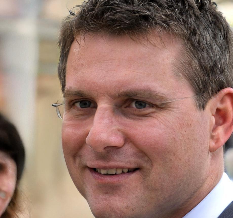 Financial communication expert reviewing budget presentation materials